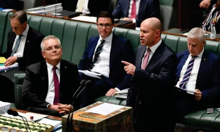  ?? Photograph: Mick Tsikas/AAP ?? Prime minister Scott Morrison and treasurer Josh Frydenberg defended the federal budget duringques­tion time on Wednesday.