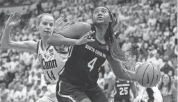  ?? JESSICA HILL/AP ?? South Carolina’s Aliyah Boston drives to the basket against UConn’s Dorka Juhasz on Sunday in Hartford, Conn.