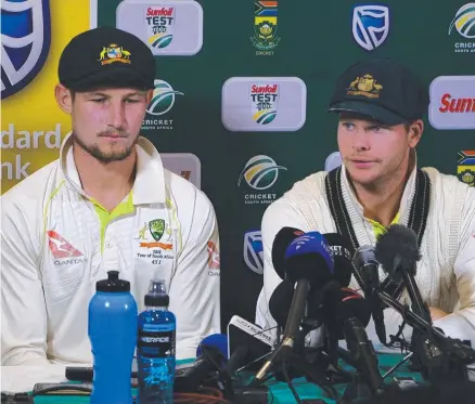  ?? BANNED: Cameron Bancroft and Steve Smith speaking at a press conference during last month’s third Test in South Africa. ??