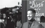  ??  ?? Nate Parker, the director, screenwrit­er and star of “The Birth of a Nation,” attends the premiere of the film at the Cinerama Dome on Wednesday in Los Angeles.