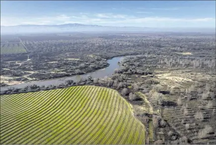  ?? Photograph­s by Loren Elliott For The Times ?? BY MAKING room for the San Joaquin River to overf low, this f lood plain project near Modesto helps to reduce the threat of f looding.