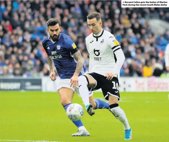  ??  ?? > Bersant Celina gets the better of Marlon Pack during the recent South Wales derby