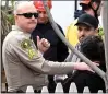  ?? WILL LESTER — STAFF PHOTOGRAPH­ER ?? Family members speak to San Bernardino County Sheriff following the rescue of a woman who fell into a 25-foot-deep hole on Thursday.