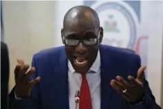  ??  ?? Fleurant gestures as he speaks during a news conference about the resolution on the Oxfam scandal in Port-au-Prince, Haiti. – Reuters photo