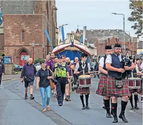  ?? ?? On song Pipers play the William Riley through the streets of Troon