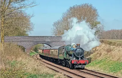  ?? ROBERT FALCONER ?? Below: ‘Modified Hall’ No. 6990 Witherslac­k Hall passes Rabbit Bridge at the Great Central Railway (GCR) on April 4 with a driver refresher train. The GCR was a recipient of the latest Culture Recovery Fund awards, receiving more than £515,000.