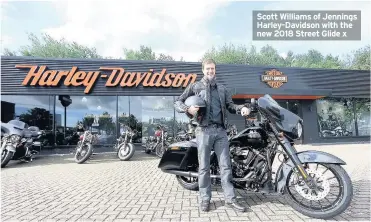  ??  ?? Scott Williams of Jennings Harley-Davidson with the new 2018 Street Glide x