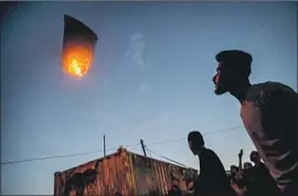  ?? Marcus Yam Los Angeles Times ?? FIERY and explosive balloons and kites have been f lying from Gaza into Israel.