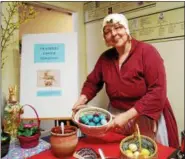  ?? LISA MITCHELL - DIGITAL FIRST MEDIA ?? Visitors to Daniel Boone Homestead in Birdsboro learned about the Easter Hare and natural materials used to dye eggs at A Homestead Easter hosted March 31. Pictured, District Township resident Anne Goda, on the board of the Friends of Daniel Boone...