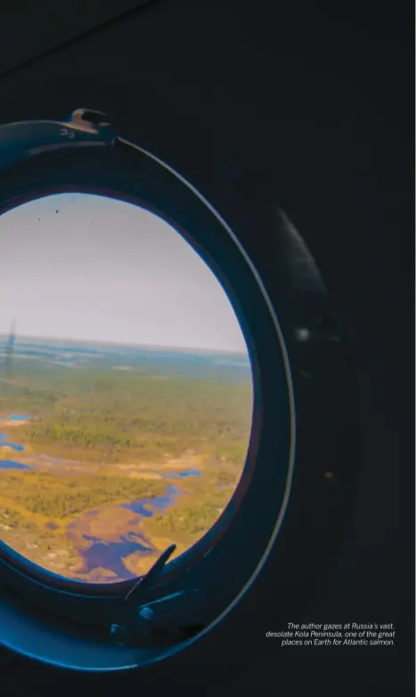  ??  ?? The author gazes at Russia’s vast, desolate Kola Peninsula, one of the great places on Earth for Atlantic salmon.