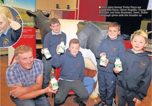  ??  ?? ● With dairy farmer Tudur Parry are pupils Ellis Parry, Oliver Hughes, Tomas McGrath and Ioan Summers. Inset, Hollie Cavanagh gives milk the thumbs up