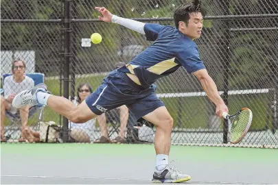  ?? STAFF PHOTOS BY PATRICK WHITTEMORE ?? UNBEATABLE: Needham’s Kevin Chao (above) returns a shot during his straight-sets win against Wellesley’s Alex Movins in the South sectional singles final, and Brookline’s Ben Moolman (below right) and Kei Ogawa serve during their victory in the doubles...