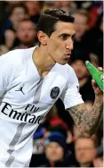  ??  ?? Cheers: Angel di Maria after a bottle was thrown