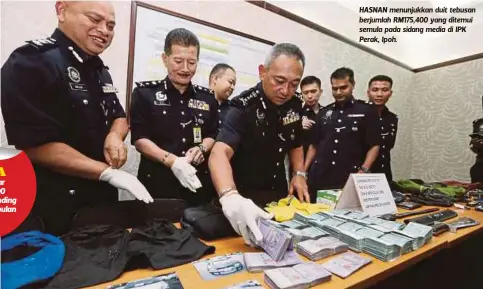  ??  ?? HASNAN menunjukka­n duit tebusan berjumlah RM175,400 yang ditemui semula pada sidang media di IPK Perak, Ipoh.