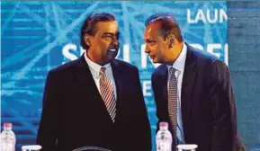  ?? REUTERS PIC ?? Estranged brothers Anil Ambani (right), chairman of the Reliance Anil Dhirubhai Ambani Group, and Mukesh, chairman of Reliance Industries Limited, called a truce last year.