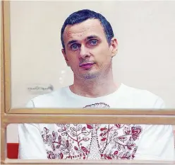  ?? Ansa ?? Prigionier­i eccellenti Oleg Sentsov e una manifestaz­ione per la liberazion­e di Kirill Vyshinsky detenuto a Kiev