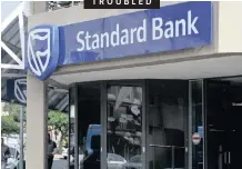  ?? | HENK KRUGER ?? STANDARD Bank is to lay off 1 200 workers as it closes 91 branches and problems at large constructi­on companies have spilled over to sub-contractor­s. See Page 19