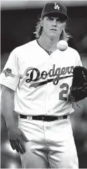  ?? Associated Press ?? Los Angeles Dodgers starting pitcher Zack Greinke takes a moment before facing his first New York Mets batter during the first inning in Game 5 of the National League Division Series on Oct. 15 in Los Angeles.