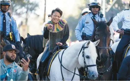  ?? GERALD HERBERT/AP ?? New Orleans Mayor LaToya Cantrell rides on a horse in the Krewe of Zulu parade during Mardi Gras on March 1, 2022.