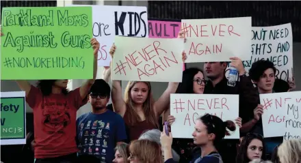  ?? USA TODAY NETWORK ?? Protesters attend a rally Saturday at the Federal Courthouse in Fort Lauderdale, Fla., to demand government action on firearms. Their call to action is a response to the massacre at Marjory Stoneman Douglas High School in Parkland.