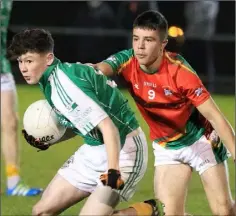  ??  ?? Callum Crehan (Naomh Eanna) and Oran Carty (Starlights) in action.