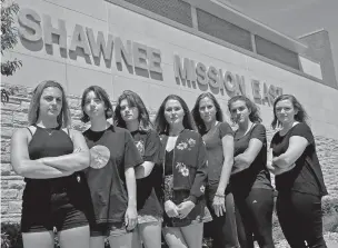  ?? CHARLIE RIEDEL/THE ASSOCIATED PRESS ?? Shawnee Mission East High School seniors from left, Katie Kuhlman, Katherine Crossette, Natalie Roth, Hannah Breckenrid­ge, Kendall Dunbar, Ireland Hague and Brena Levy gather earlier this month in front of their campus in Prairie Village, Kan. The...