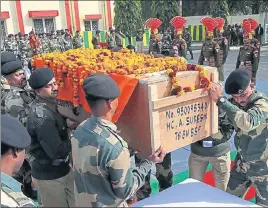  ??  ?? Officers and soldiers of BSF carry the coffin of Head Constable A Suresh during the wreathlayi­ng ceremony at the BSF headquarte­rs in Jammu on Thursday. NITIN KANOTRA/HT