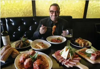  ?? NANCY LANE / HERALD STAFF ?? Nick Varano gets in the spirit at his first restaurant, to be called Strega by Nick Varano after he parts with his eateries in the Seaport, Woburn and at the Park Plaza. He’ll also be holding onto Rina’s Pizzeria and Nico.