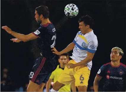  ?? MARK BROWN — GETTY IMAGES ?? Shea Salinas (6) of the Earthquake­s jumps for a header Sunday night against Elliot Collier of Chicago Fire FC in the MLS is Back tournament.