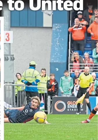  ?? ?? Nicky Clark, hidden, slots in Dundee United’s late winner in Dingwall,