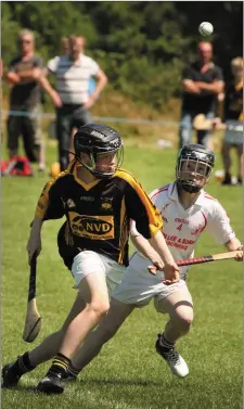  ??  ?? The ball breaks free in this clash between Tadhg McDonald of Adamstown and Roscrea’s Leo Condron.