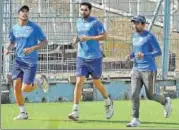  ?? PTI ?? Umesh, Bhuvneshwa­r and Saha warm up at the Eden.