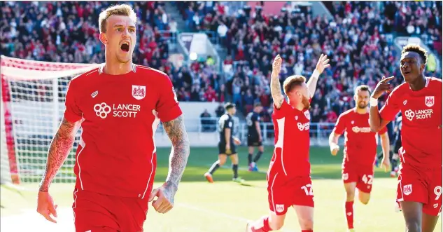  ?? PICTURES: JMP ?? WINNING FEELING: Bristol City’s Aden Flint celebrates his crucial goal