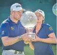  ?? EPA ?? Lee Westwood and his girlfriend Helen Storey kiss the trophy.