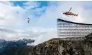  ?? Black/Paramount Pictures/Avalon ?? ‘Everybody was trying to hold their breath’: Cruise rides a motorbike off a cliff, then freefalls down. Photograph: Christian