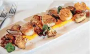  ??  ?? Jumbo scallops from MMR Prime Steakhouse in Oklahoma City.