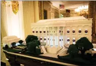  ?? (The New York Times/Doug Mills) ?? A re-creation of the White House is made from 275 pounds of gingerbrea­d.