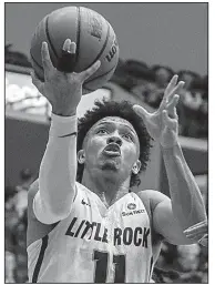  ?? Arkansas Democrat-Gazette/MITCHELL PE MASILUN ?? UALR guard Jaizec Lottie visited a specialist Wednesday to confirm the severity of his hand injury. Surgery won’t be required and a timetable for his recovery is set at 10-12 days, depending on how quickly his range of motion returns, said Trojans Coach Darrell Walker.