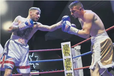  ??  ?? Seaham’s Jordan Ellison (right) defends against Lewis Ritson at the Rainton Meadows Arena on Saturday. Picture by Craig Leng
