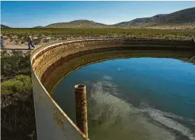  ?? Michael Ciaglo / Houston Chronicle ?? A tank holds water for use in hydraulic fracturing. Water is also a byproduct of energy production in the Permian Basin.