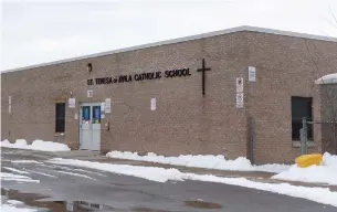  ?? CATHIE COWARD THE HAMILTON SPECTATOR ?? An outbreak of COVID-19 was declared at St. Teresa of Avila Catholic Elementary School on Wednesday after five positive cases were found. The board has reported four more student cases.