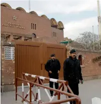  ?? AP ?? Private guards stand alert outside the Gadaffi cricket stadium the venue of the PSL final match. —