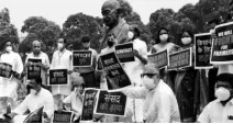  ?? FILE PHOTO ?? Members of Opposition parties stage a protest over suspension of eight Rajya Sabha members, farmers’ problems and other issues, during the Monsoon Session of Parliament, in New Delhi