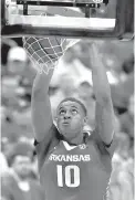  ?? AP Photo/Jeff Roberson ?? ■ Arkansas’ Daniel Gafford dunks during the second half against Florida in the Southeaste­rn Conference tournament March 9 in St. Louis.