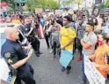  ?? JOE BURBANK/ORLANDO SENTINEL ?? Orlando police Sgt. Brian Wilkes talks to demonstrat­ors near Orlando City Hall on Wednesday. Orlando demonstrat­ors continue to protest the police killing of George Floyd in Minneapoli­s, May 25.