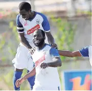  ?? RICARDO MAKYN /MULTIMEDIA PHOTO EDITOR ?? Reno striker Craig Foster (right) celebratES with captain Renorio Downswell after scoring a goal against Waterhouse in a recent Red Stripe Premier League match at Waterhouse Stadium.