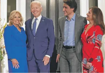  ?? MANDEL NGAN/AFP VIA GETTY IMAGES ?? President Joe Biden and first lady Jill Biden are greeted Thursday night by Canadian Prime Minister Justin Trudeau and his wife, Sophie Grégoire Trudeau, at Rideau Cottage, the prime minister’s residence, in Ottawa. The president and prime minister will have talks on several subjects: the war in Ukraine, climate change, trade, mass migration and China.