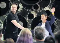  ?? AP ?? SpaceX founder and chief executive Elon Musk (left) with Japanese billionair­e Yusaku Maezawa after announcing him as the first private passenger on a trip around the moon in California. —