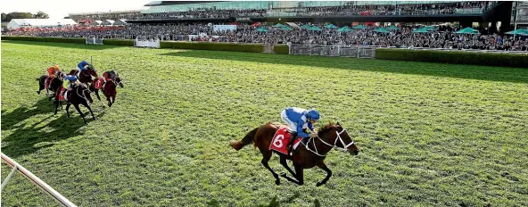  ?? GETTY IMAGES ?? Winx, with Hugh Bowman in the saddle, powers to victory in the Colgate Optic White Stakes at Randwick on Saturday.