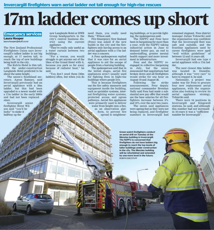  ?? ROBYN EDIE/STUFF ?? Green-watch firefighte­rs conduct an aerial drill on Tuesday at the Menzies building in Invercargi­ll. The NZPFU is concerned that firefighte­rs do not have ladders big enough to reach the top levels of taller buildings under constructi­on in the city. The Menzies building will be refurbishe­d and extended by one more level in the future.